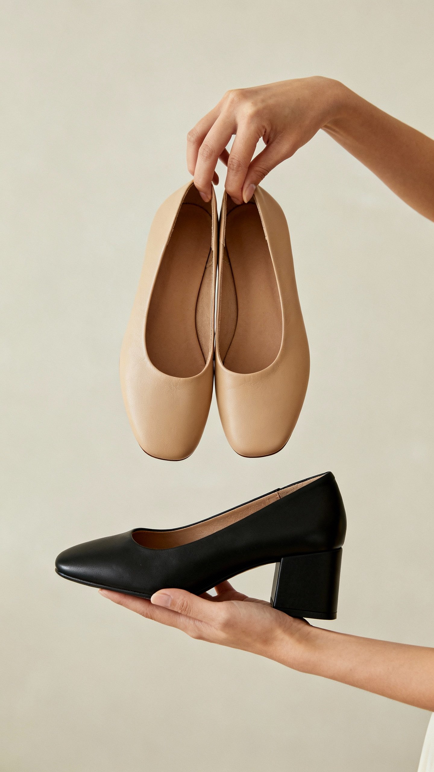 Female hands swapping flats for black block heels