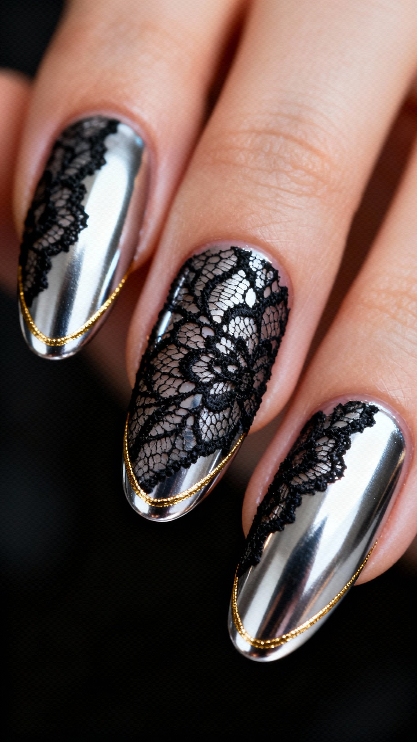 Macro shot chrome silver nails, black lace overlay, ultra-thin gold chrome outline