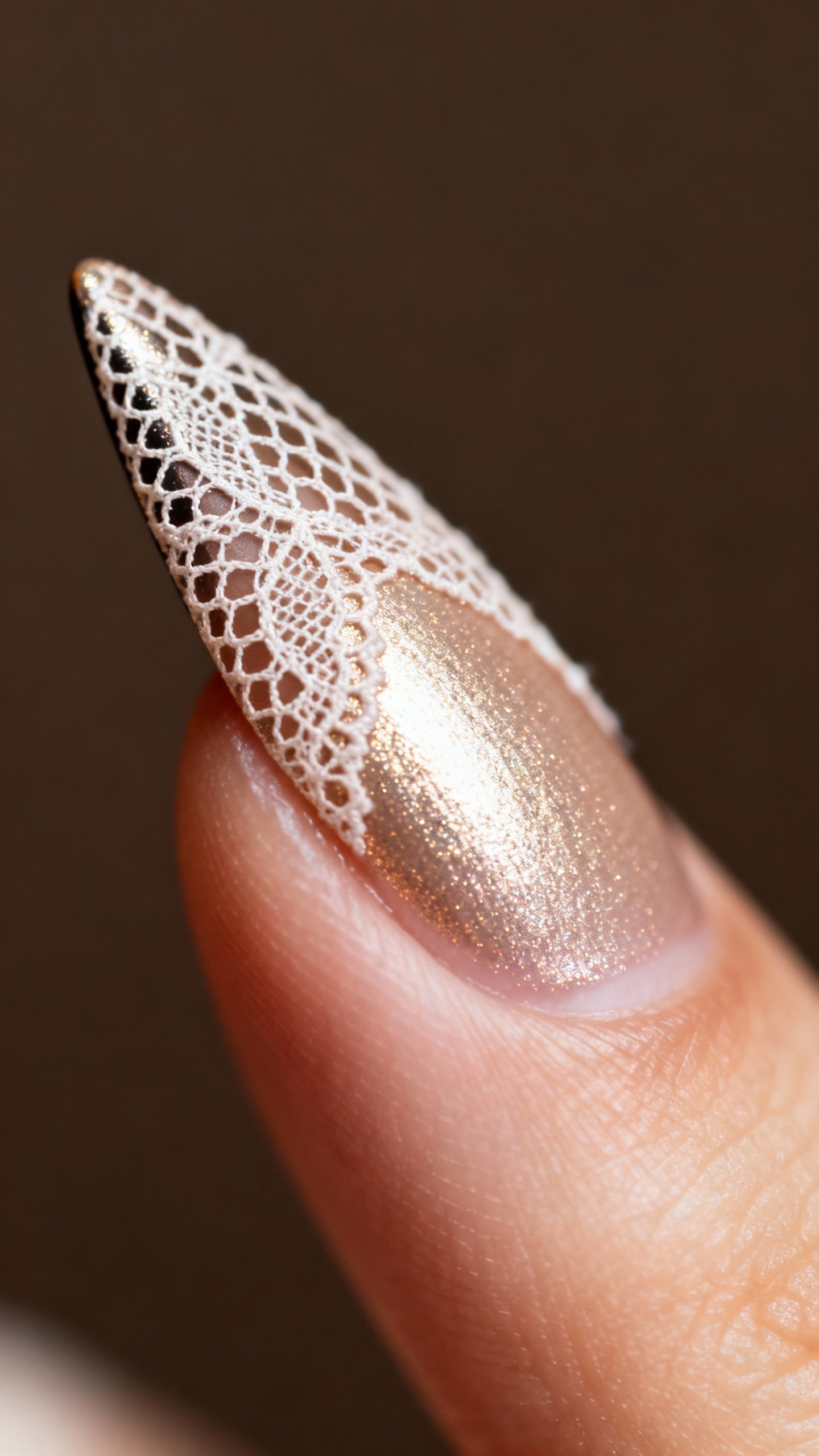 Macro view winged liner tip with micro lace mesh, champagne inner corner highlight