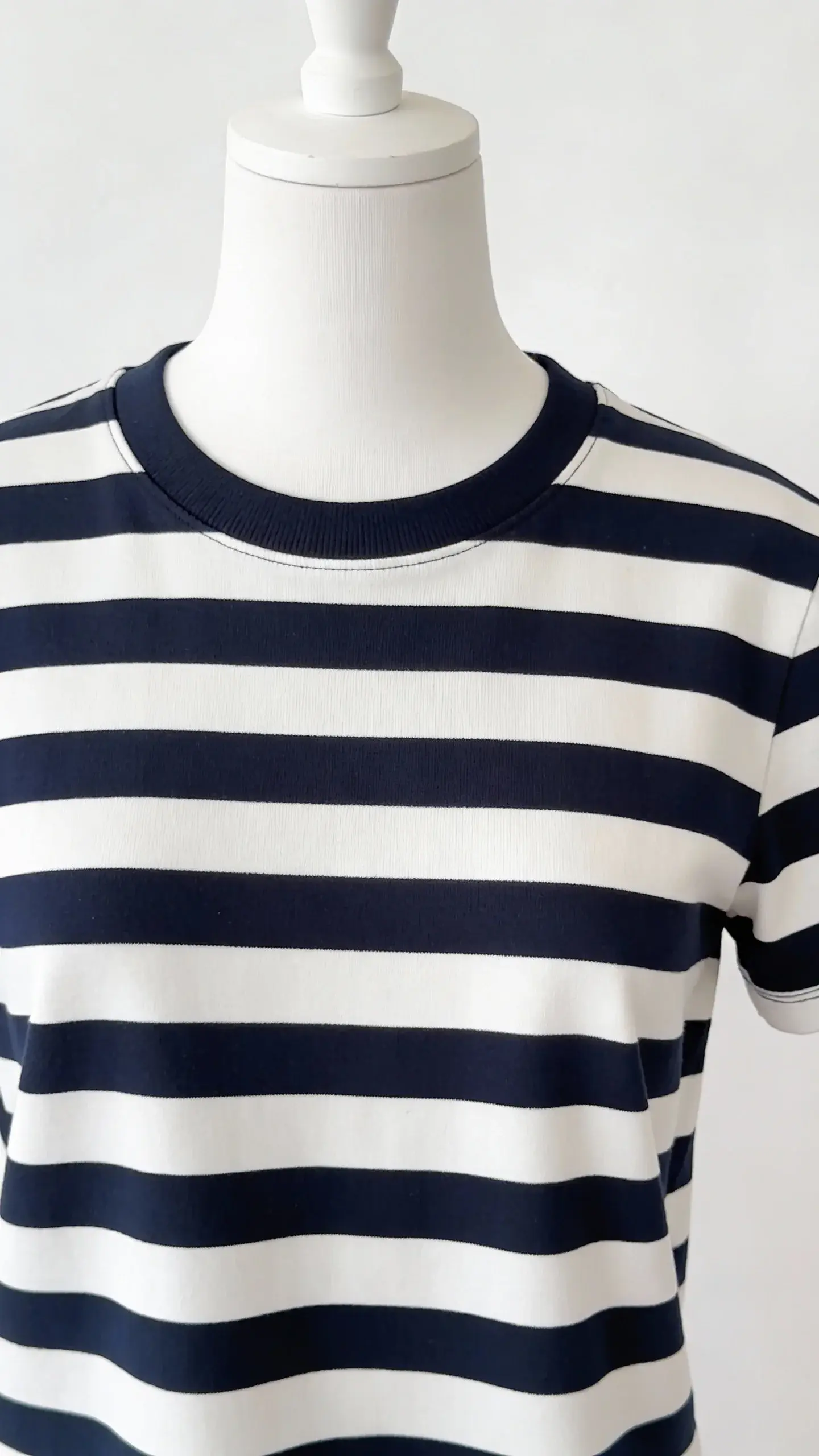 navy-and-white Breton striped top on white mannequin