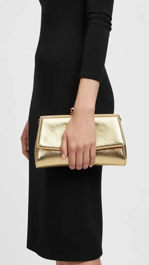 amber evening fragrance with black dress and gold clutch