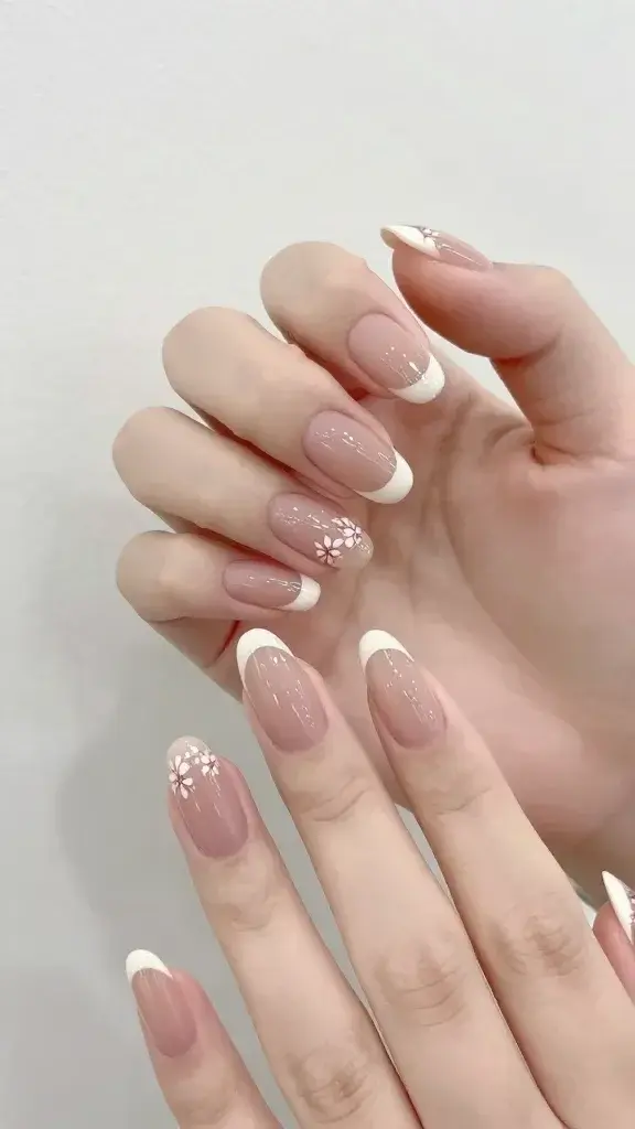 milky nude almond nails, whisper-thin French, floral