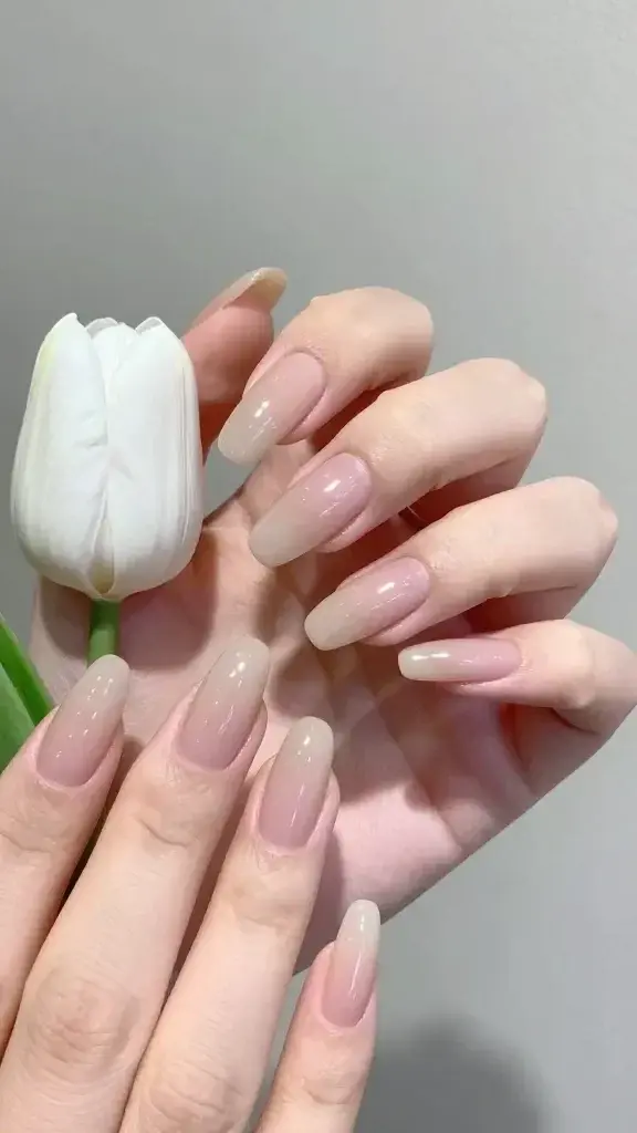 nude almond nails, white tulip buds near cuticles