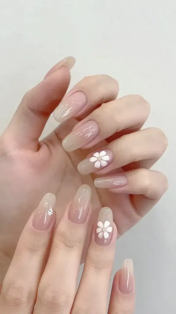 translucent nude almond nails, minimal white blossoms