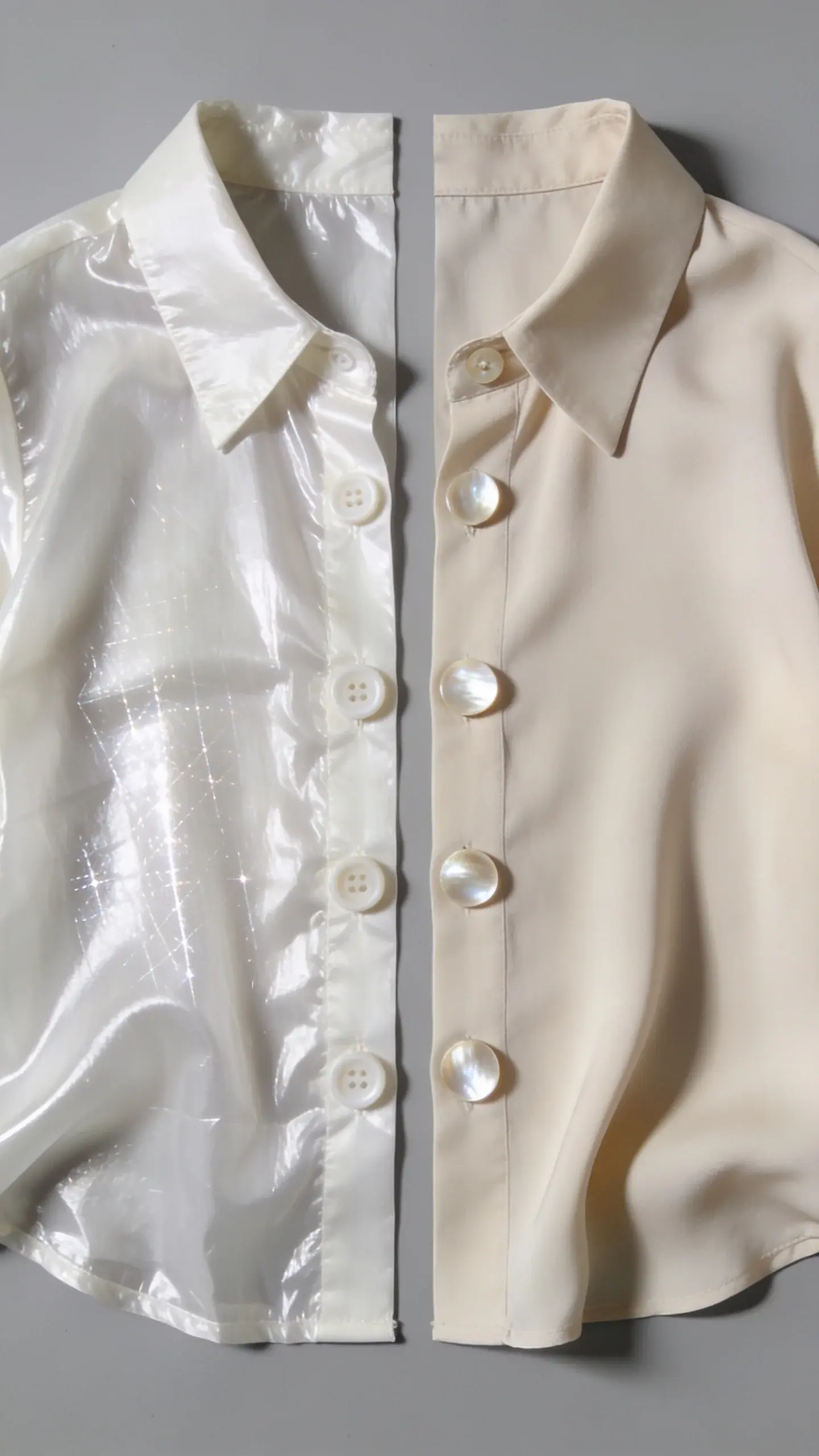 Side-by-side styled flat lay: left panel shows flimsy shiny polyester blouse with visible static cling and cheap plastic buttons; right panel shows matte viscose blouse with fluid drape and neat mother-of-pearl buttons. Neutral grey background, soft natural light.